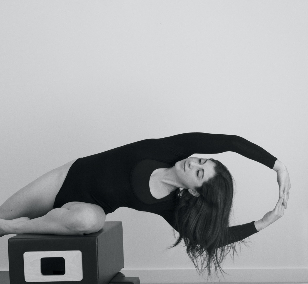 Woman doing Pilates on a reformer