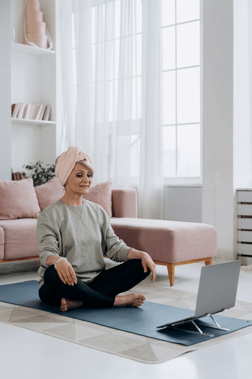 Woman learning Pilates online