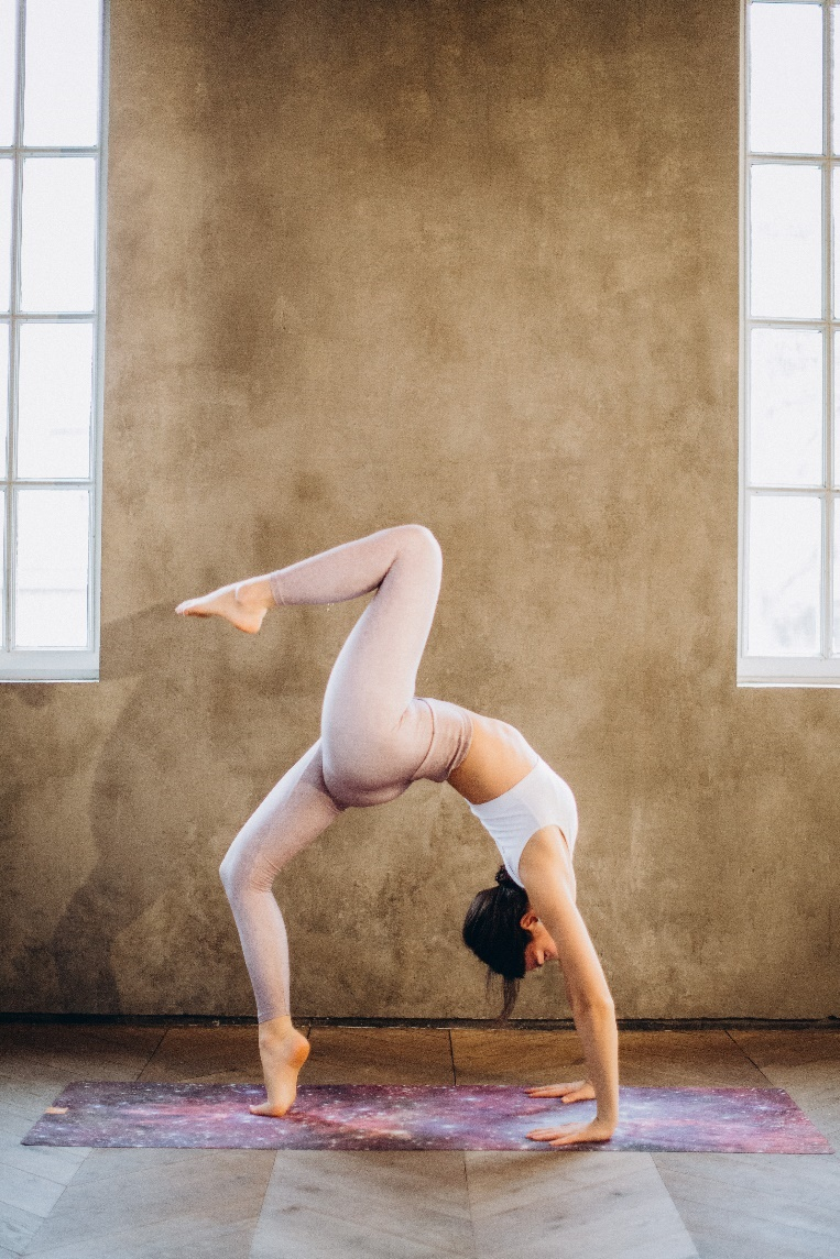 A woman doing yoga in a studio