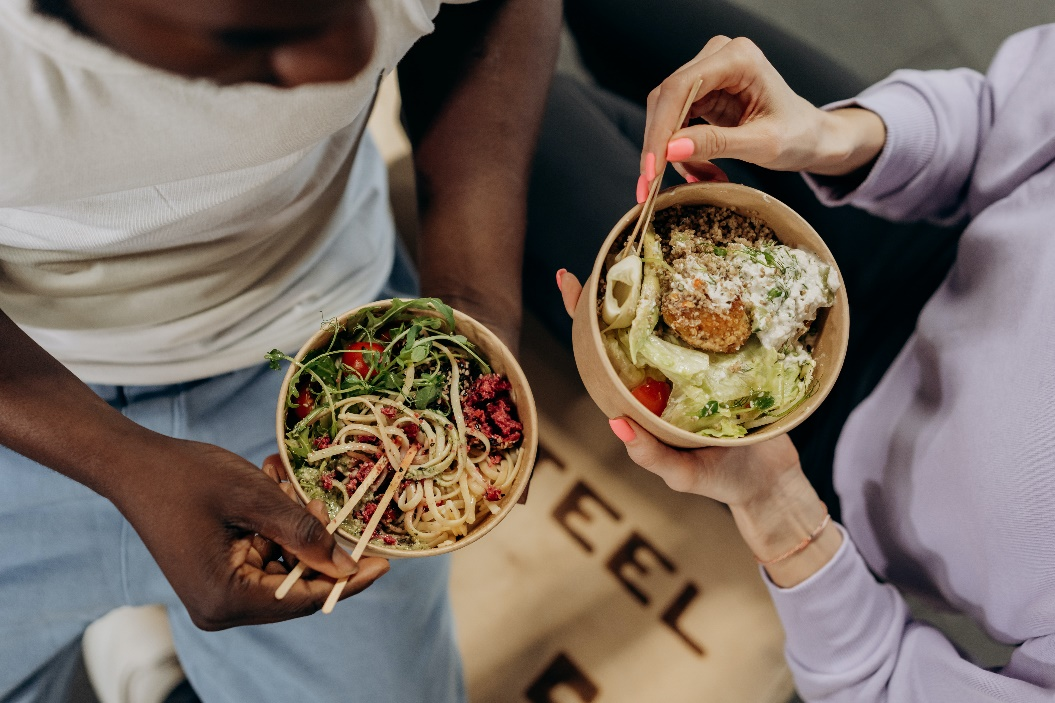 Two women eating healthy food