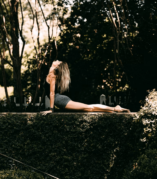 A woman stretching before her workout yoga