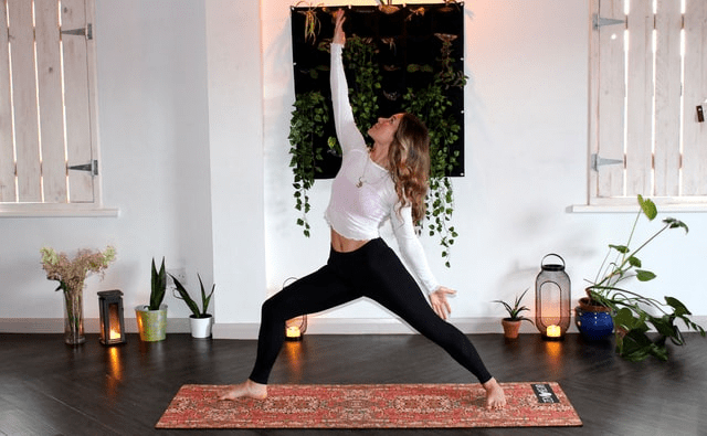  A woman doing yoga in the comfort of her home