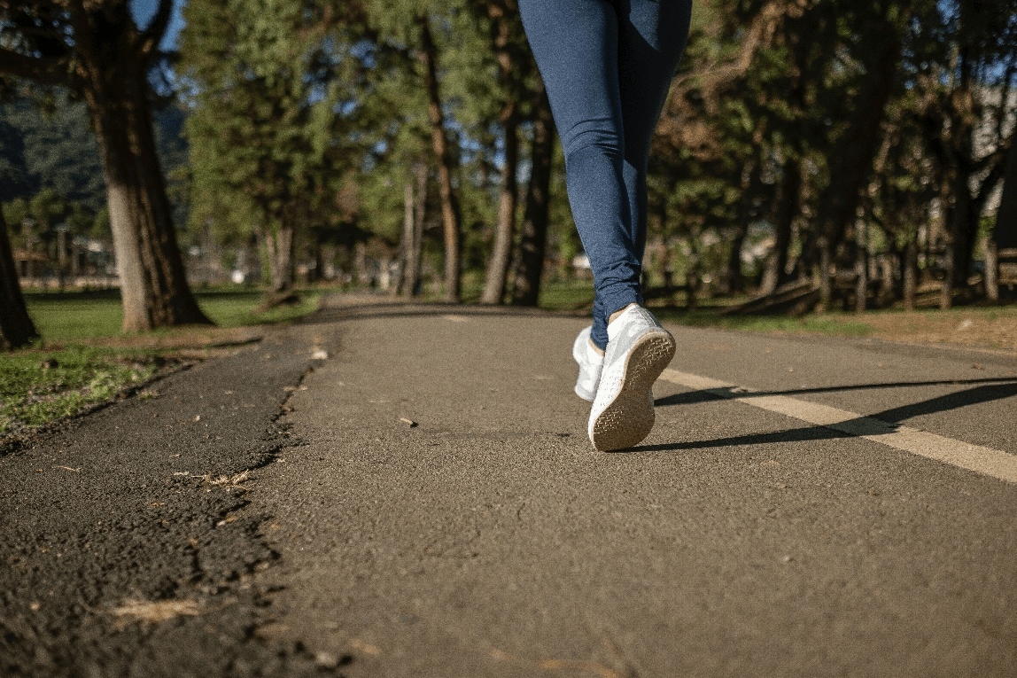 A woman walking on the road