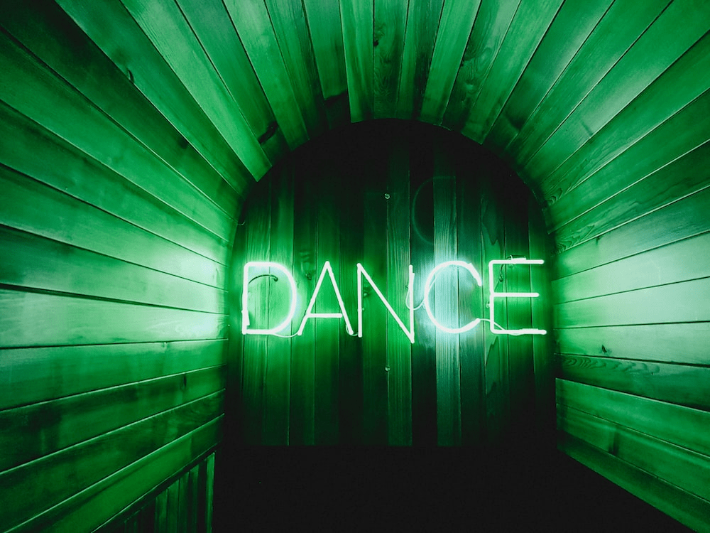 neon lighting saying dance.