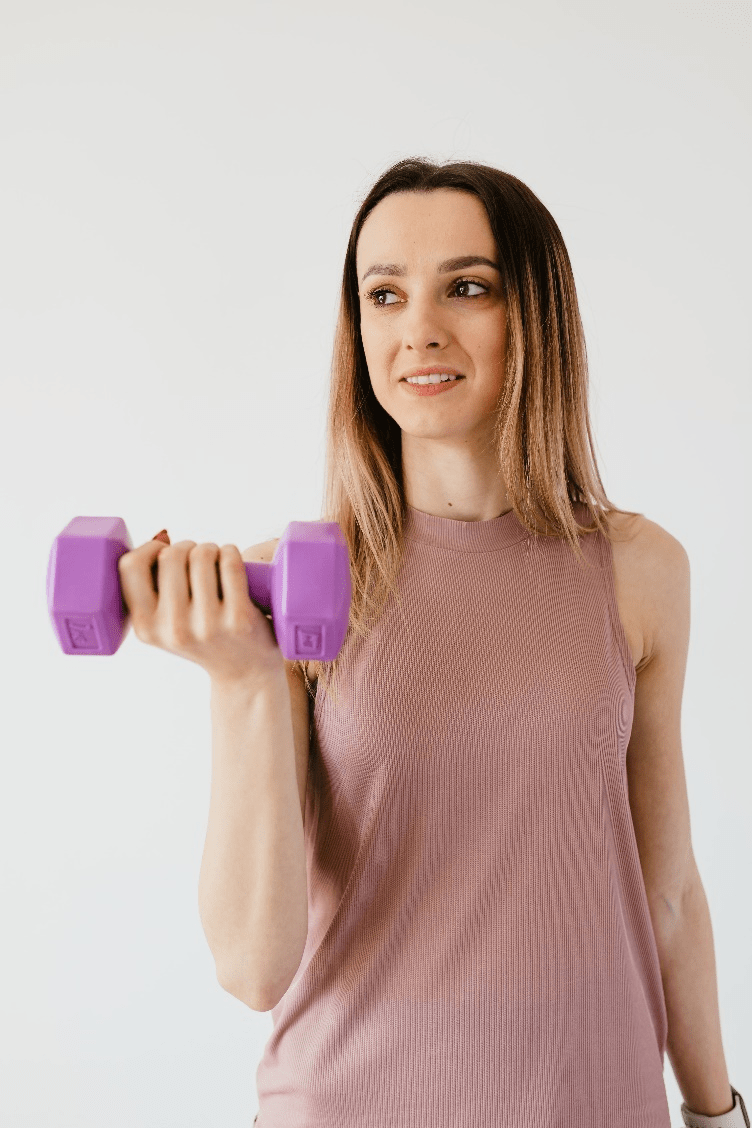 Woman carrying dumbbells