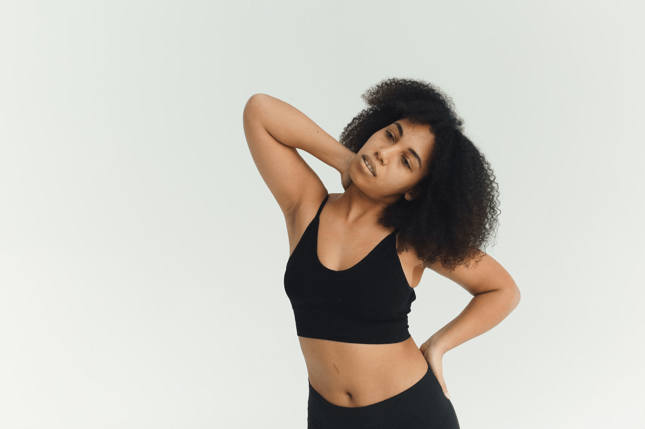 A woman doing neck exercise during a flexibility and mobility workout