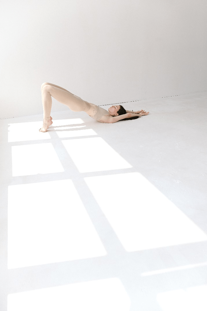  A woman doing a shoulder bridge 