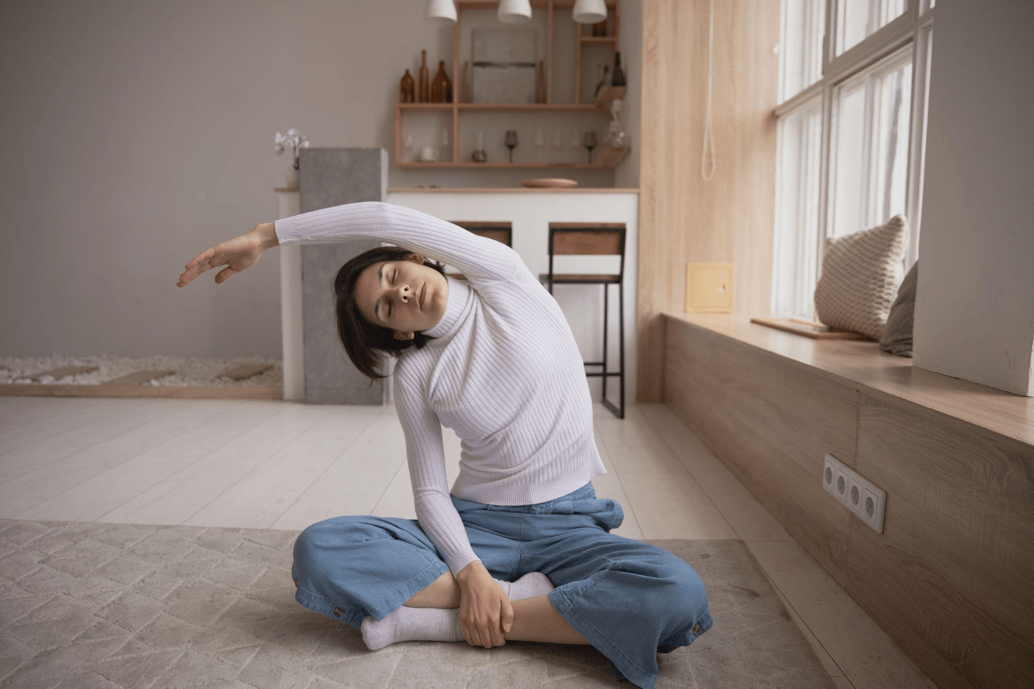 A woman stretching when working from home