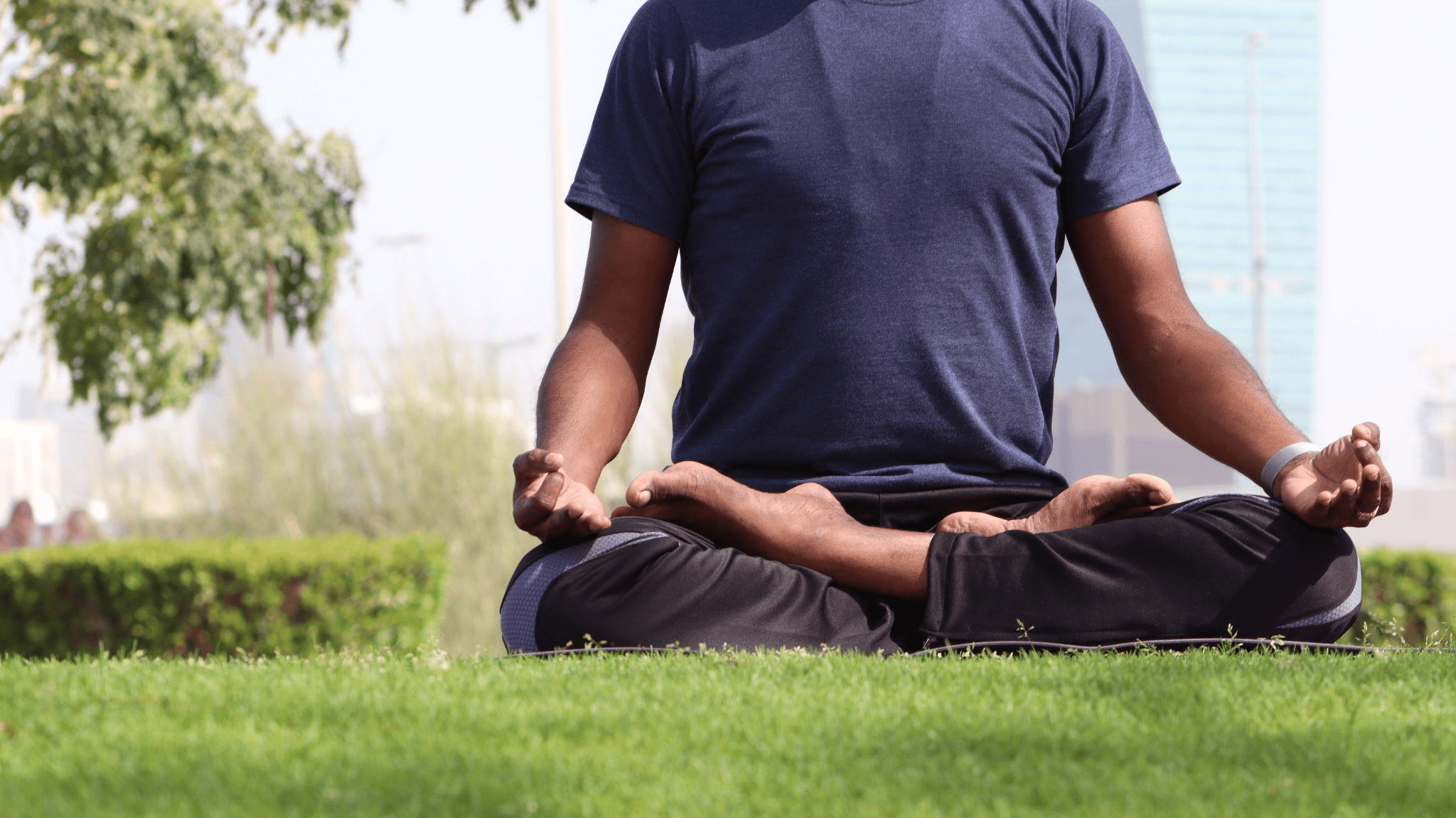  A man meditating in a garden