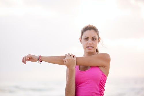 a woman stretching her arm