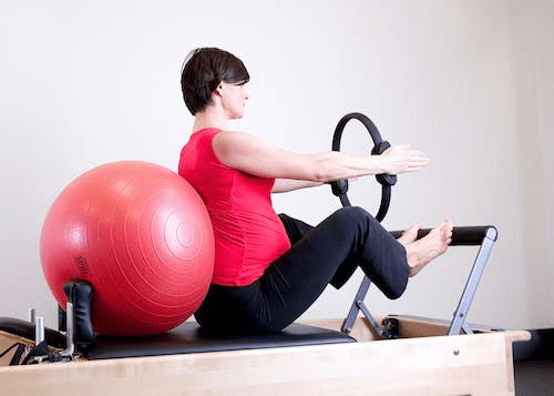 a woman in a pilates class