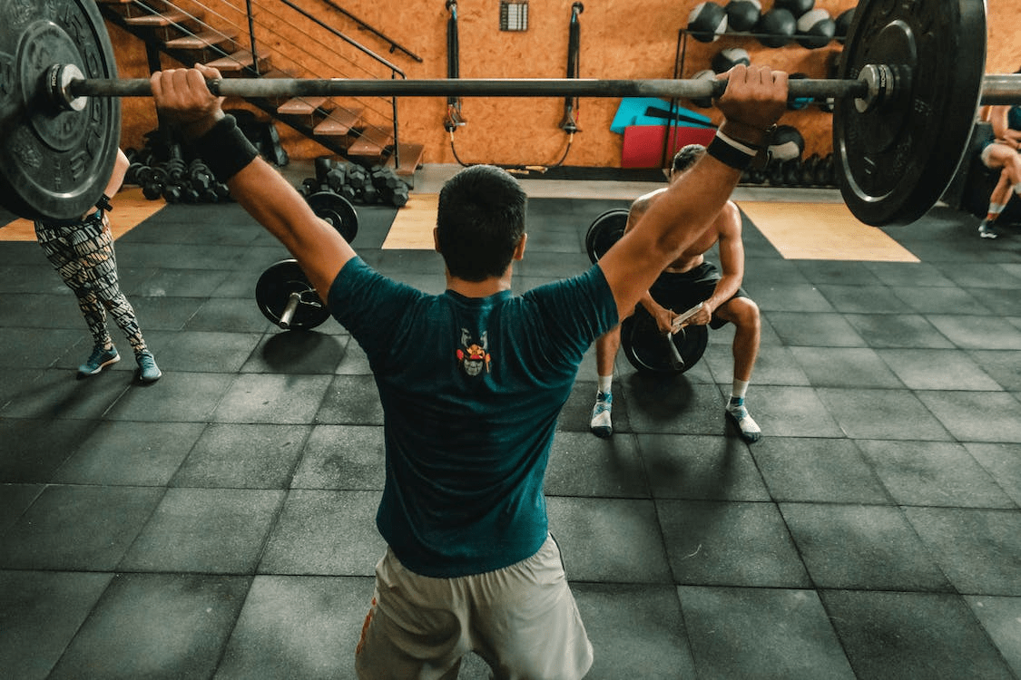 a person lifting a barbell 