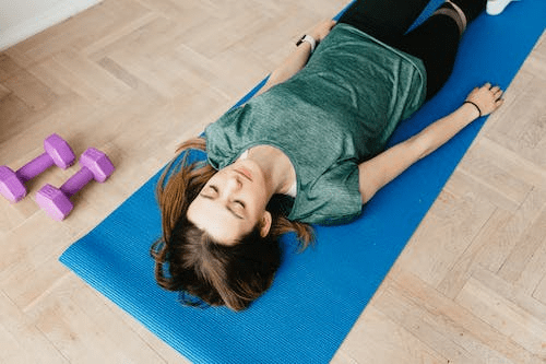  A woman doing Savasana