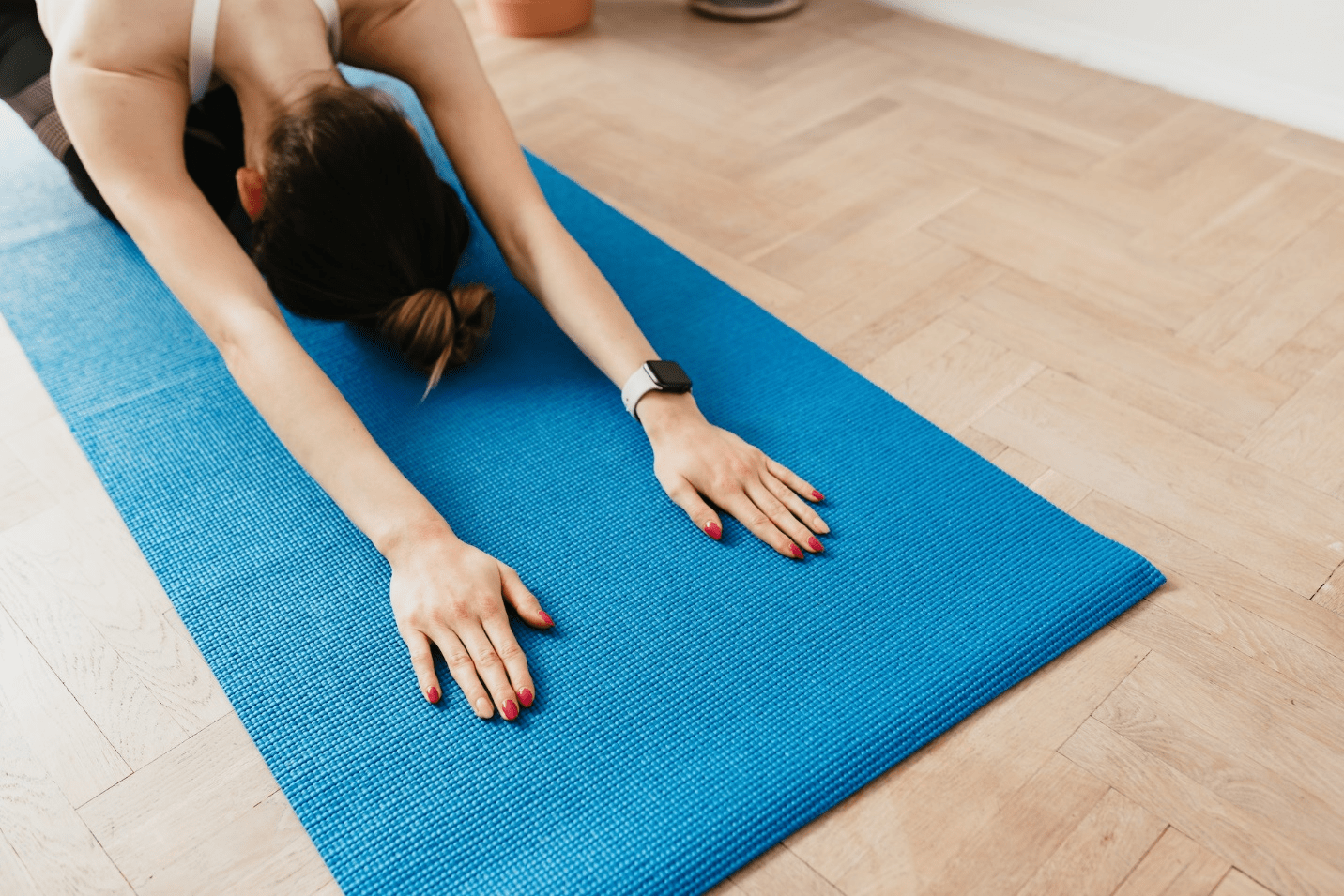 Woman stretching on a mat