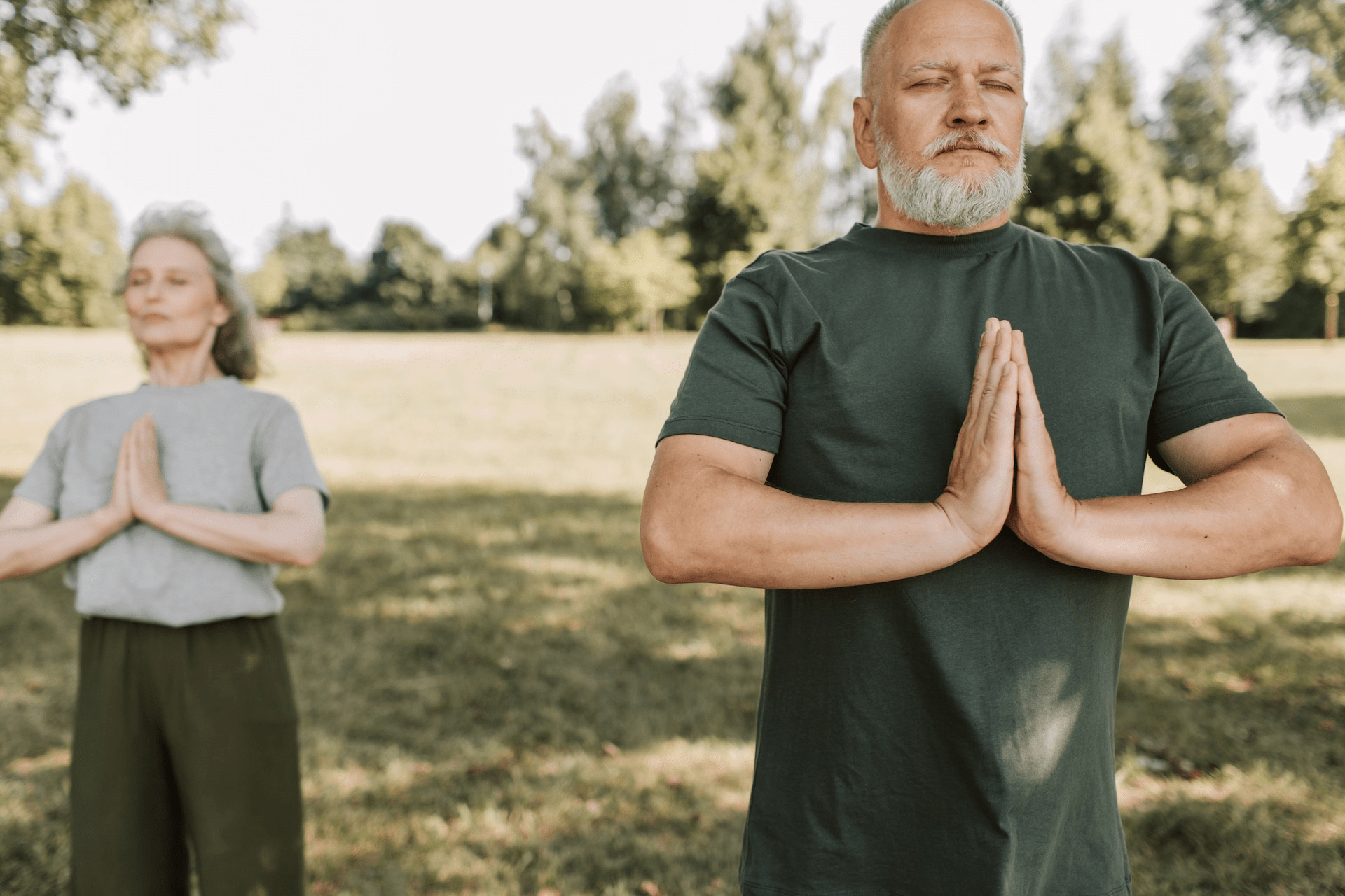 Elderly couple doing yoga