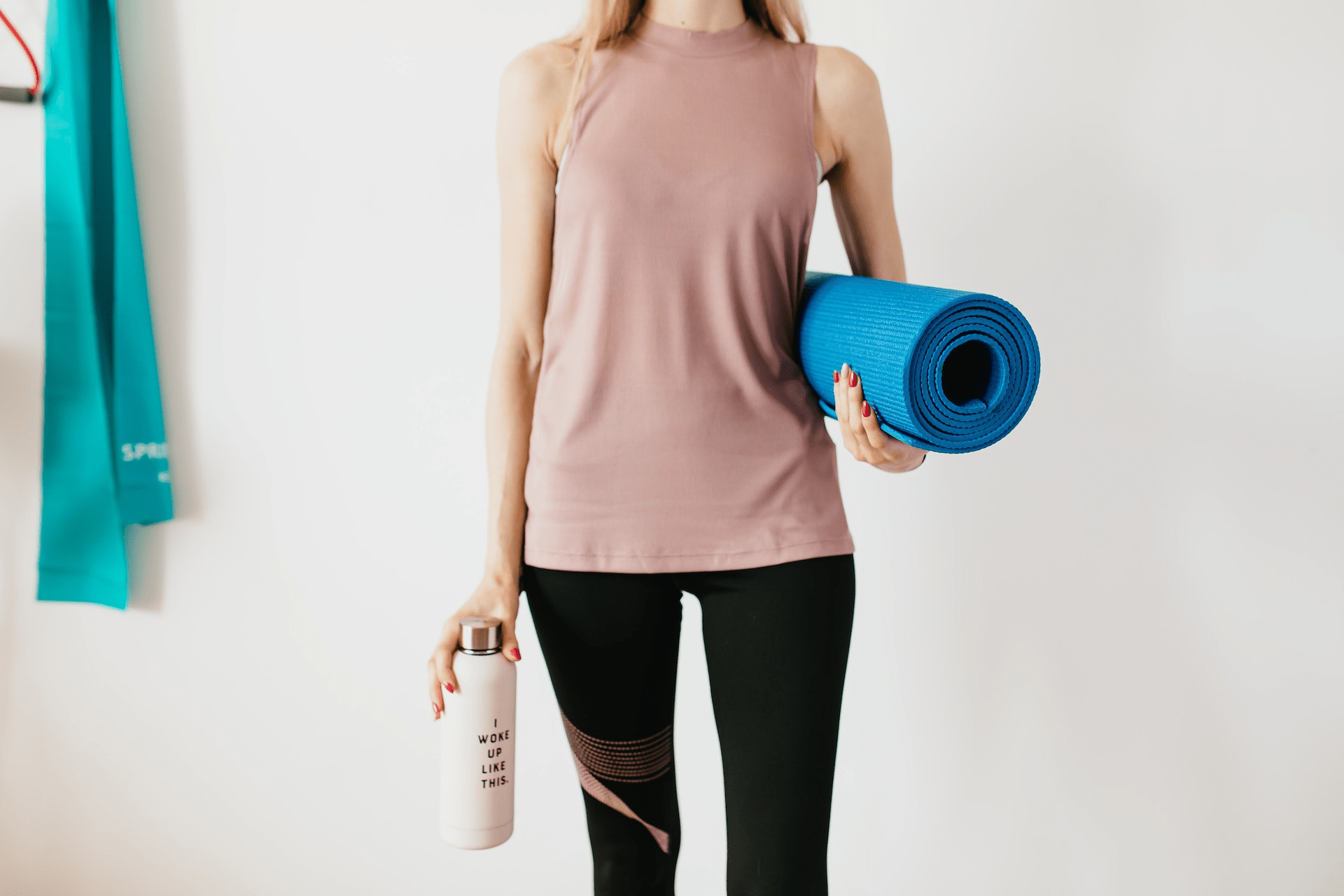 Woman holding a yoga mat