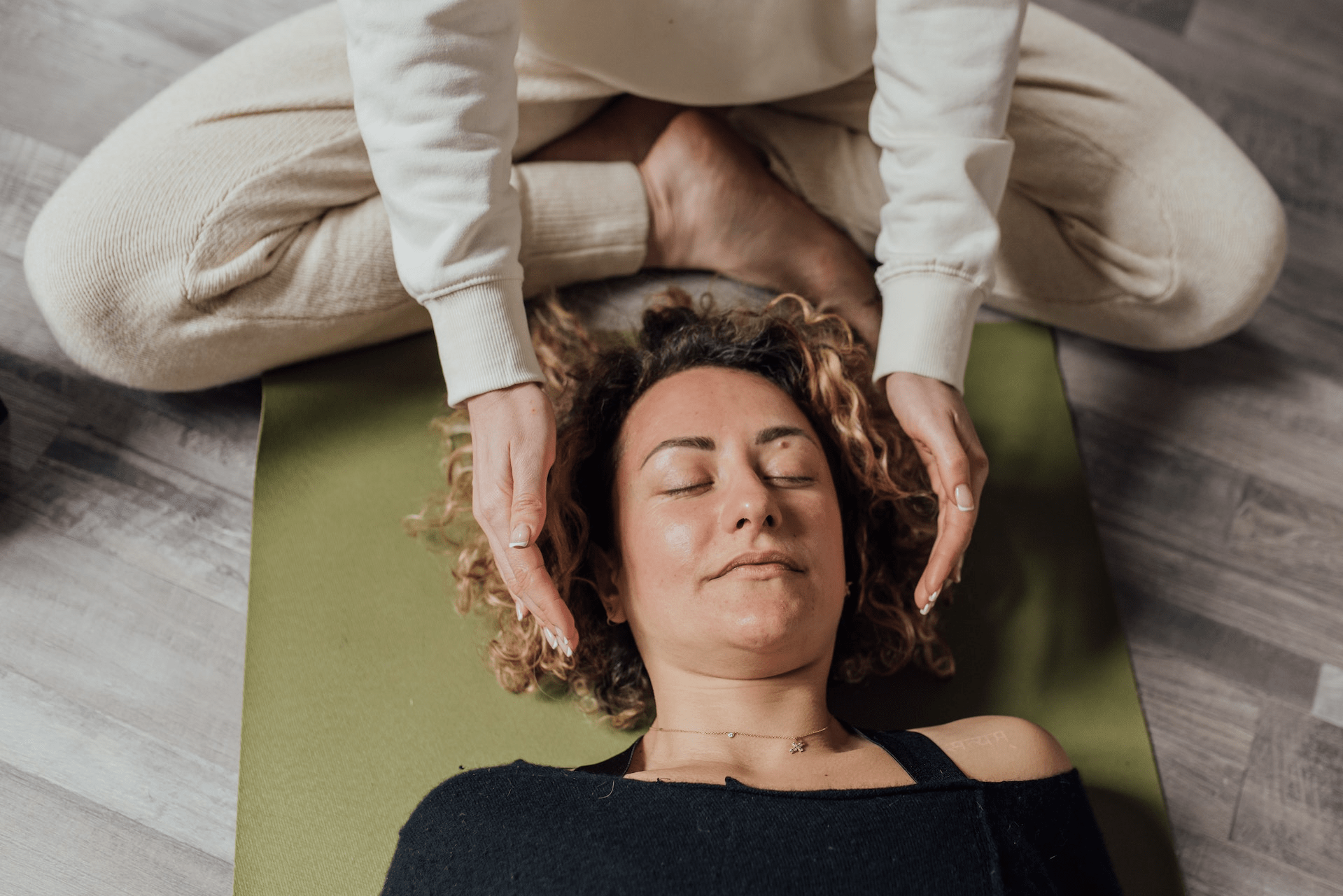 Woman lying on a yoga mat