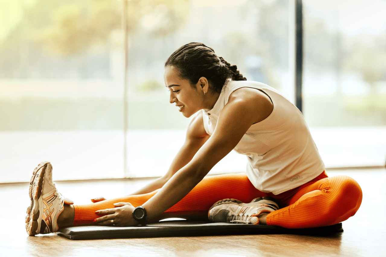 A Woman Stretching on the Ground