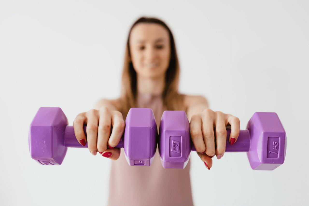 A Woman Holding Dumbbells